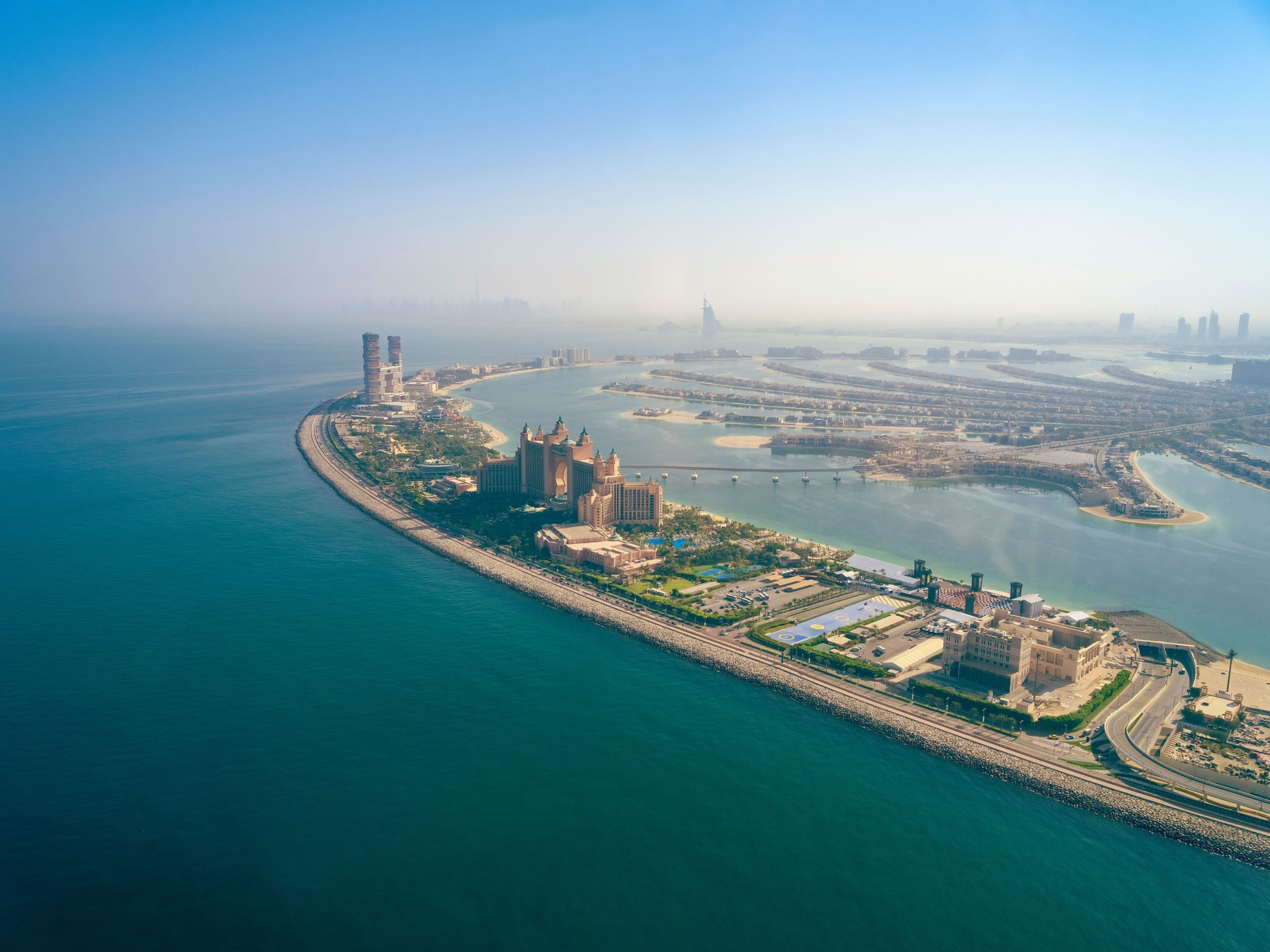 Aerial view of artificial palm island in Dubai Aerial view of artificial palm island in Dubai